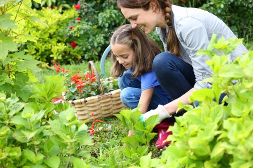 Gardener in Queens Park starting work with tools